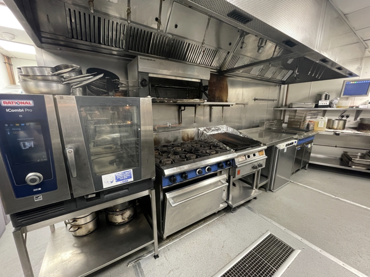 a kitchen with stainless steel appliances